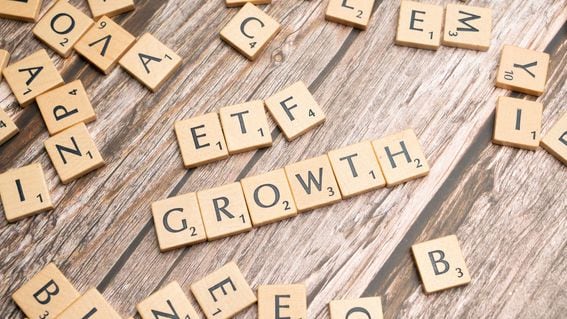 Scrabble tiles spelling out "ETF GROWTH"